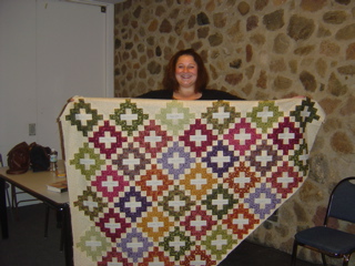 Author Jennifer Weiner displays the quilt in progress.